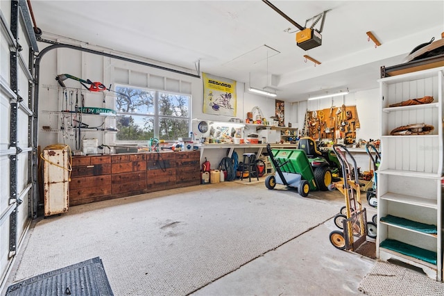 10230 289th St E, Myakka City, FL 34251 - garage featuring a workshop area and a garage door opener