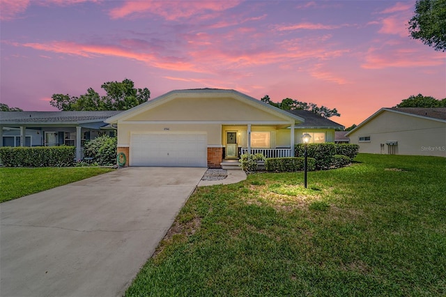 8704 SW 94th Ln Unit G, Ocala, FL 34481 - ranch-style home featuring an attached garage, covered porch, a front yard, and concrete driveway