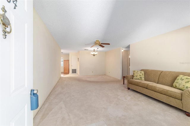 8704 SW 94th Ln Unit G, Ocala, FL 34481 - living room with light carpet and a ceiling fan