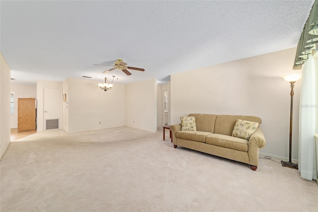 8704 SW 94th Ln Unit G, Ocala, FL 34481 - living area featuring a ceiling fan, light colored carpet, and a textured ceiling