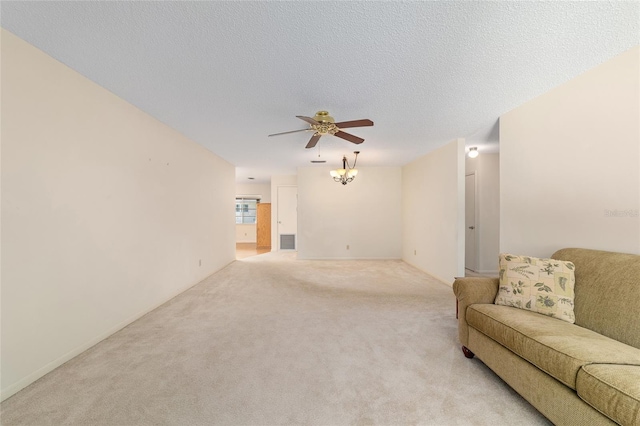 8704 SW 94th Ln Unit G, Ocala, FL 34481 - living area featuring ceiling fan, light carpet, and a textured ceiling