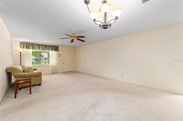 8704 SW 94th Ln Unit G, Ocala, FL 34481 - unfurnished room with light colored carpet, a ceiling fan, a chandelier, and a textured ceiling