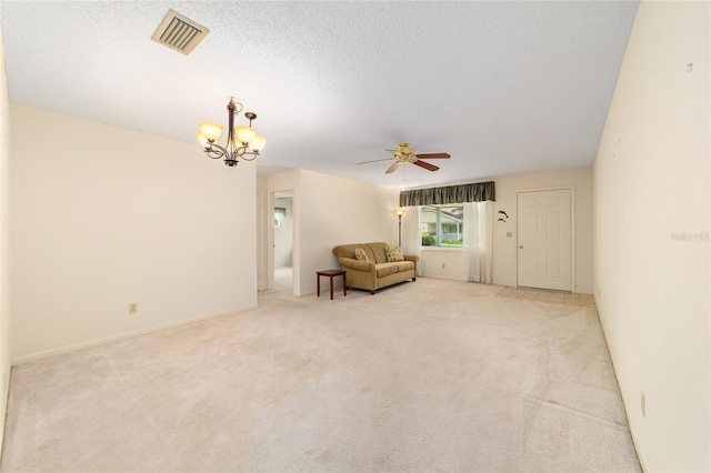 8704 SW 94th Ln Unit G, Ocala, FL 34481 - living area featuring a chandelier, ceiling fan, light carpet, and a textured ceiling