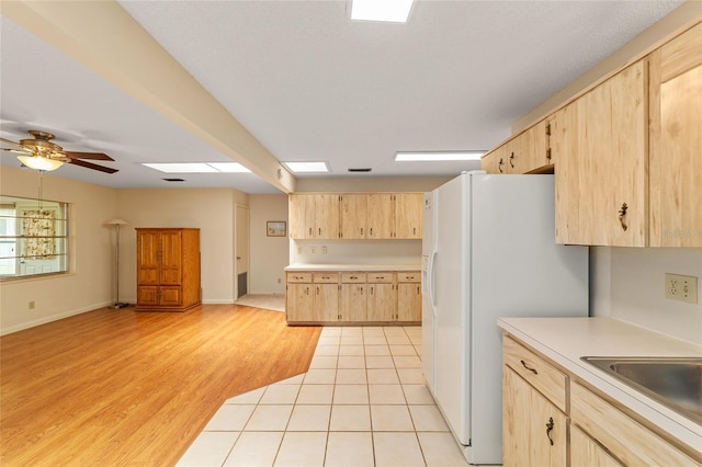 8704 SW 94th Ln Unit G, Ocala, FL 34481 - kitchen featuring light brown cabinetry, white fridge with ice dispenser, light countertops, and ceiling fan