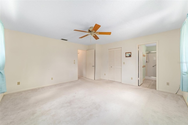8704 SW 94th Ln Unit G, Ocala, FL 34481 - unfurnished bedroom featuring light colored carpet, connected bathroom, ceiling fan, and a closet