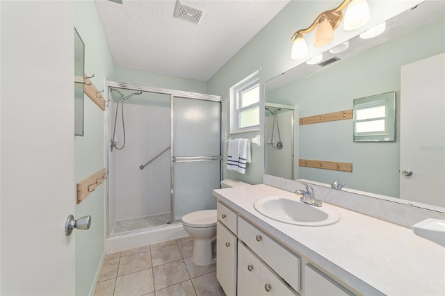 8704 SW 94th Ln Unit G, Ocala, FL 34481 - full bathroom with a stall shower, vanity, tile patterned flooring, and a textured ceiling