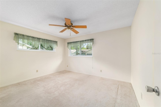 8704 SW 94th Ln Unit G, Ocala, FL 34481 - unfurnished room with carpet, a ceiling fan, and a textured ceiling