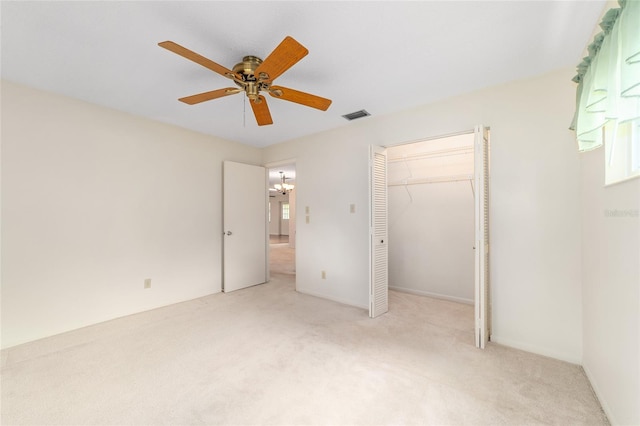 8704 SW 94th Ln Unit G, Ocala, FL 34481 - unfurnished bedroom with carpet, a closet, a ceiling fan, and multiple windows
