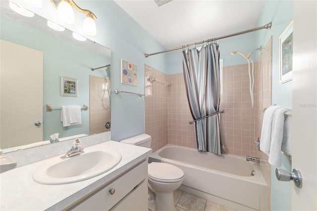 8704 SW 94th Ln Unit G, Ocala, FL 34481 - bathroom featuring vanity, shower / bath combo with shower curtain, and tile patterned floors