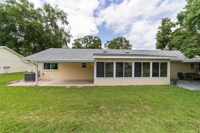 8704 SW 94th Ln Unit G, Ocala, FL 34481 - back of property with a patio area, a yard, and roof with shingles