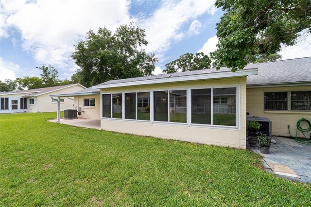 8704 SW 94th Ln Unit G, Ocala, FL 34481 - rear view of property with a patio and a yard