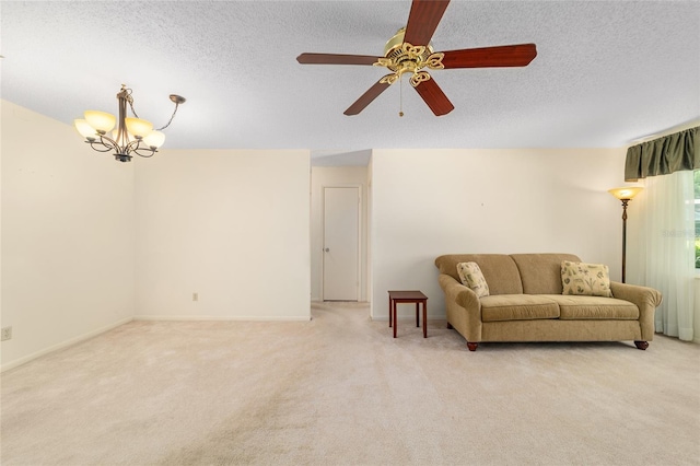 8704 SW 94th Ln Unit G, Ocala, FL 34481 - living room with light colored carpet, a chandelier, a ceiling fan, and a textured ceiling