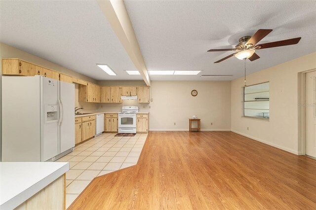 8704 SW 94th Ln Unit G, Ocala, FL 34481 - kitchen with white appliances, light brown cabinets, light countertops, a ceiling fan, and under cabinet range hood