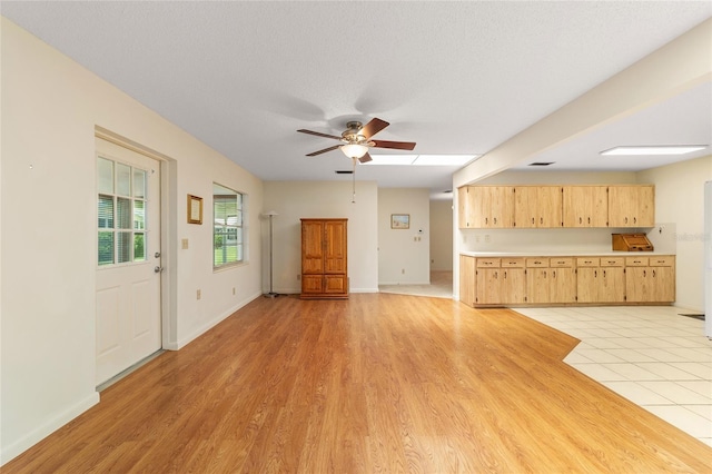 8704 SW 94th Ln Unit G, Ocala, FL 34481 - unfurnished living room featuring a ceiling fan and light wood-type flooring