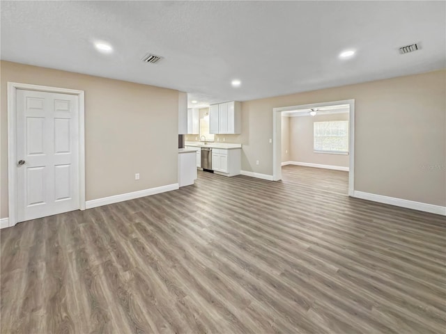 5 Bahia Circle Pl, Ocala, FL 34472 - unfurnished living room with wood finished floors, recessed lighting, and a ceiling fan