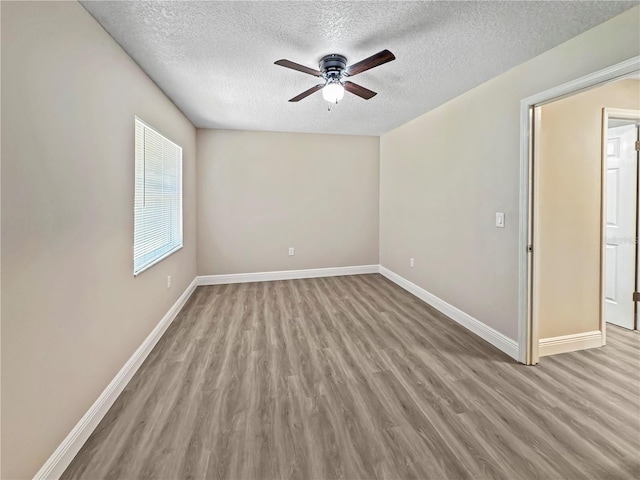 5 Bahia Circle Pl, Ocala, FL 34472 - unfurnished room featuring a textured ceiling, wood finished floors, and a ceiling fan