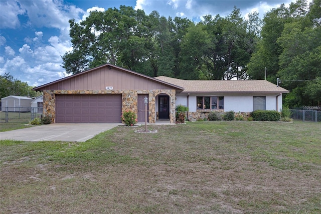 3427 SE 137th St, Summerfield, FL 34491 - ranch-style home with stone siding, a garage, and driveway
