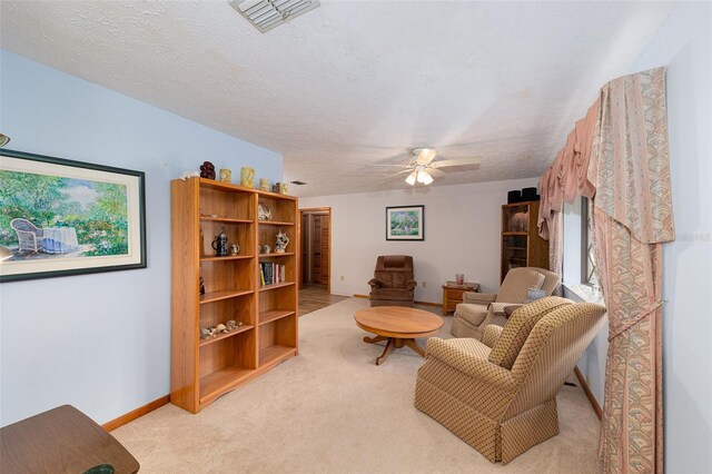 3427 SE 137th St, Summerfield, FL 34491 - sitting room featuring light colored carpet and a ceiling fan