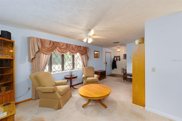 3427 SE 137th St, Summerfield, FL 34491 - sitting room with carpet floors, a ceiling fan, and a textured ceiling