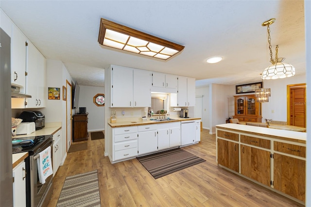 3427 SE 137th St, Summerfield, FL 34491 - kitchen with stainless steel range with electric stovetop, white dishwasher, range hood, light countertops, and light wood-style flooring
