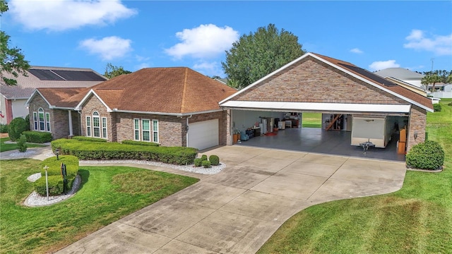 9641 SE 70th Ter, Ocala, FL 34472 - view of front of house with a garage, a front lawn, driveway, and brick siding