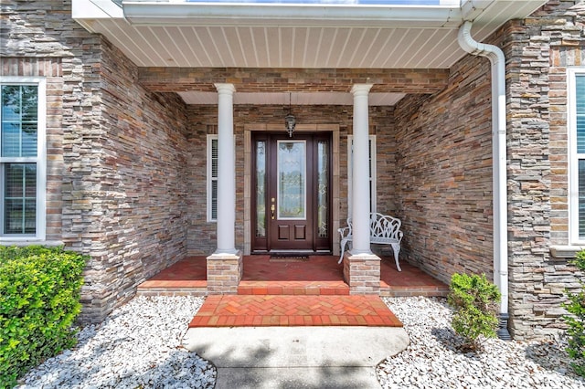 9641 SE 70th Ter, Ocala, FL 34472 - doorway to property featuring covered porch and stone siding