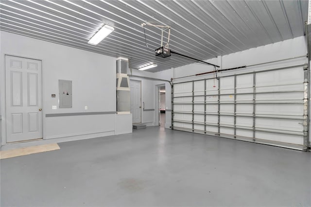 9641 SE 70th Ter, Ocala, FL 34472 - garage featuring electric panel and a garage door opener