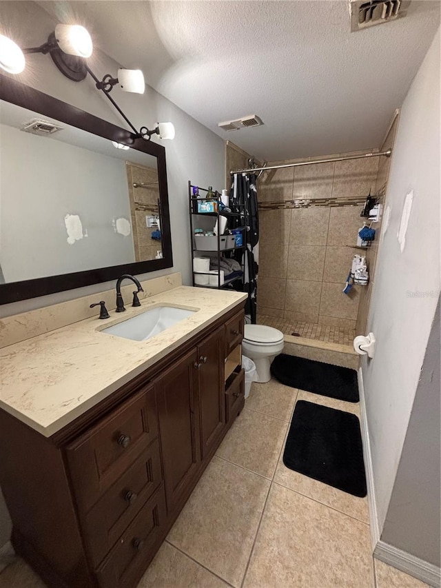 8134 Fairways Cir Unit R203, Ocala, FL 34472 - bathroom featuring tile patterned floors, a shower stall, vanity, and a textured ceiling