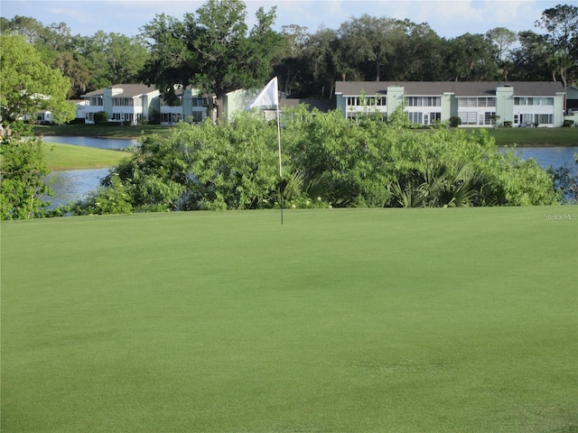 8134 Fairways Cir Unit R203, Ocala, FL 34472 - surrounding community featuring a water view, view of scattered trees, and a lawn