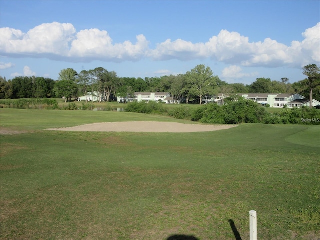 8134 Fairways Cir Unit R203, Ocala, FL 34472 - view of community featuring golf course view, a lawn, and view of wooded area