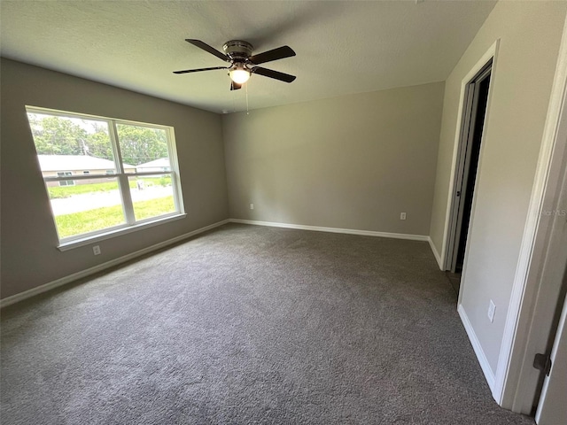 8795 Juniper Rd, Ocala, FL 34480 - unfurnished room featuring a ceiling fan, carpet, and a textured ceiling