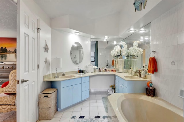 502 SE Guava Ter, Port St Lucie, FL 34983 - bathroom with ensuite bath, tile patterned flooring, and vanity