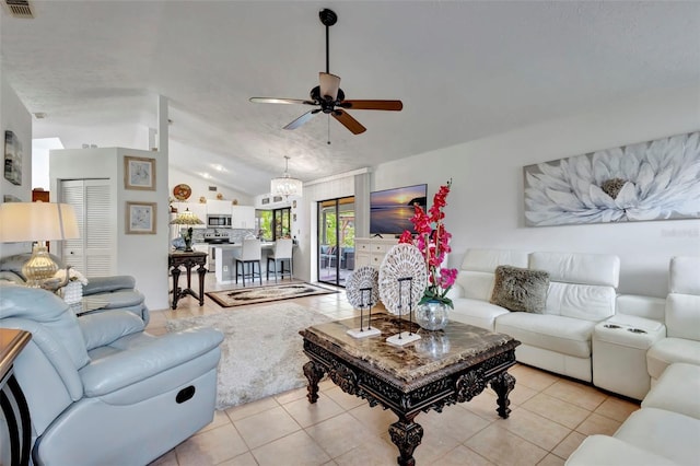 502 SE Guava Ter, Port St Lucie, FL 34983 - living area with lofted ceiling, light tile patterned floors, ceiling fan, and a chandelier