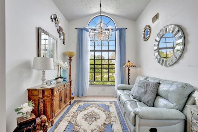502 SE Guava Ter, Port St Lucie, FL 34983 - living area with lofted ceiling, a chandelier, light tile patterned floors, and a textured ceiling