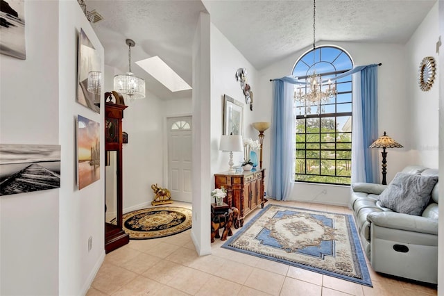 502 SE Guava Ter, Port St Lucie, FL 34983 - sitting room featuring a chandelier, lofted ceiling, a textured ceiling, and tile patterned flooring