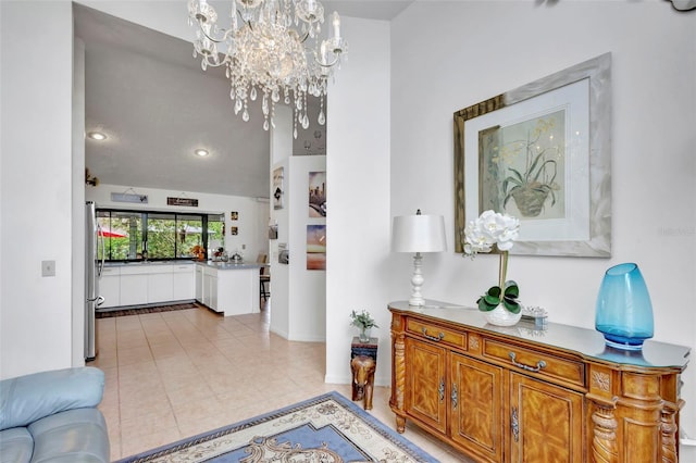 502 SE Guava Ter, Port St Lucie, FL 34983 - hall with a chandelier, light tile patterned flooring, and recessed lighting