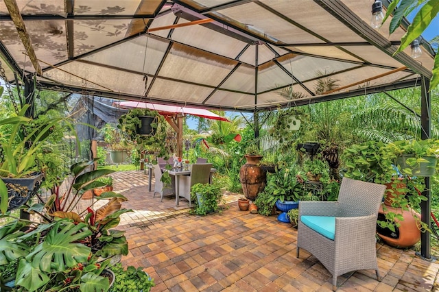 502 SE Guava Ter, Port St Lucie, FL 34983 - view of patio with a gazebo and outdoor dining space