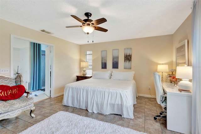 502 SE Guava Ter, Port St Lucie, FL 34983 - bedroom featuring light tile patterned floors and ceiling fan