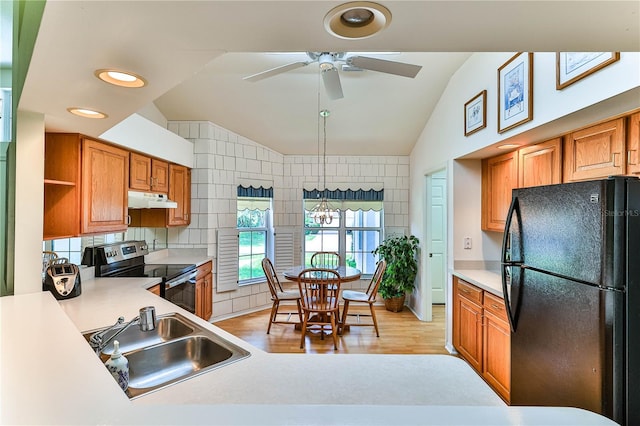 585 W Barrymore Dr, Beverly Hills, FL 34465 - kitchen featuring freestanding refrigerator, stainless steel range with electric cooktop, lofted ceiling, under cabinet range hood, and ceiling fan