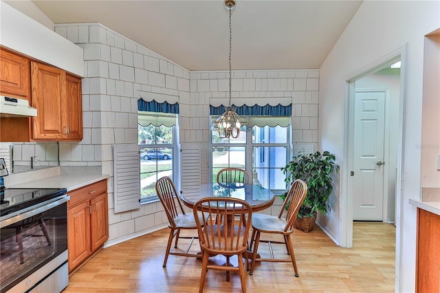 585 W Barrymore Dr, Beverly Hills, FL 34465 - dining space featuring light wood finished floors, a chandelier, and lofted ceiling