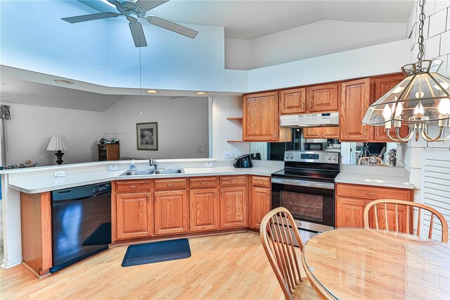 585 W Barrymore Dr, Beverly Hills, FL 34465 - kitchen featuring appliances with stainless steel finishes, lofted ceiling, a peninsula, under cabinet range hood, and light countertops