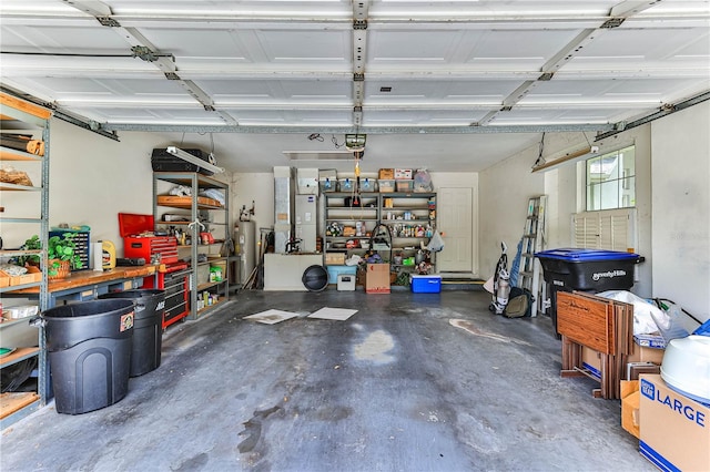 585 W Barrymore Dr, Beverly Hills, FL 34465 - garage with electric water heater and a garage door opener