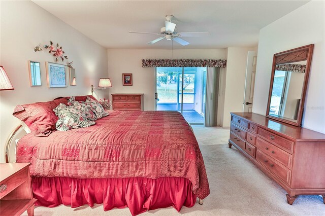 585 W Barrymore Dr, Beverly Hills, FL 34465 - bedroom with access to outside, light carpet, and a ceiling fan