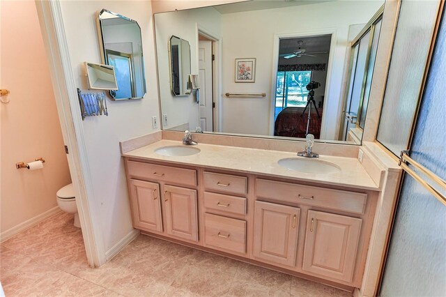 585 W Barrymore Dr, Beverly Hills, FL 34465 - bathroom featuring double vanity, tile patterned flooring, and a ceiling fan