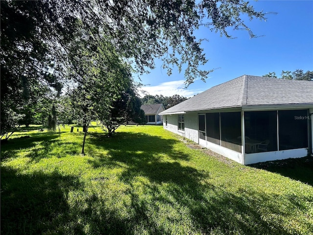 585 W Barrymore Dr, Beverly Hills, FL 34465 - view of grassy yard with a sunroom