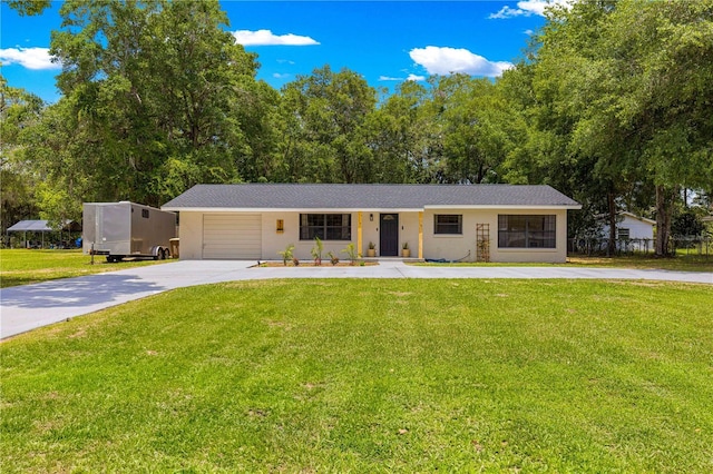 802 NE 39th Ct, Ocala, FL 34470 - single story home with concrete driveway, an attached garage, a front yard, stucco siding, and view of scattered trees