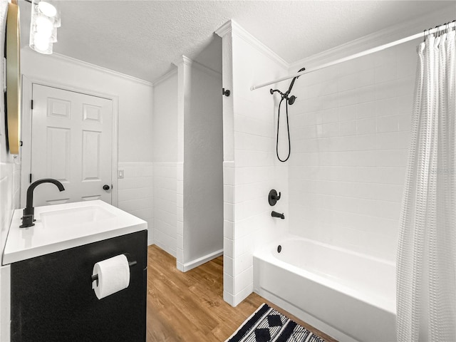 802 NE 39th Ct, Ocala, FL 34470 - bathroom featuring crown molding, wood finished floors, shower / bathtub combination with curtain, vanity, and a textured ceiling