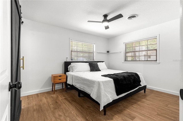 802 NE 39th Ct, Ocala, FL 34470 - bedroom featuring wood finished floors and a ceiling fan