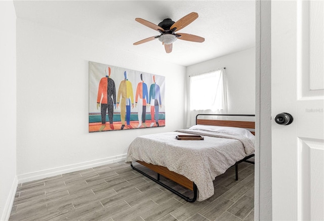 802 NE 39th Ct, Ocala, FL 34470 - bedroom with wood finished floors and a ceiling fan
