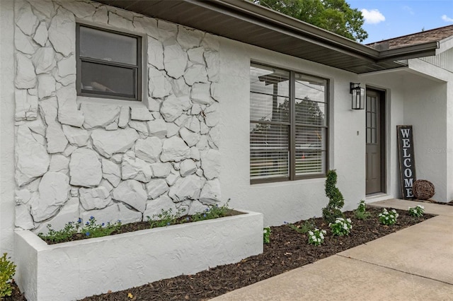21191 SW Plantation St, Dunnellon, FL 34431 - view of exterior entry featuring stucco siding and stone siding